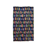 Opened fleece blanket with bookshelf pattern on a white background
