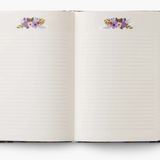 Rifle Paper Co Garden Party Journal with floral hardcover, matching gold pen, and lined pages. Stylish and gift-ready. Available at Be Charmed.
