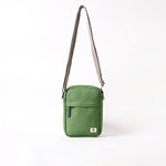 A compact and lightweight weather-resistant artichoke Ori Bond Pocket Crossbody Bag with functional zip pockets, available at Be Charmed.