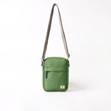 A compact and lightweight weather-resistant artichoke Ori Bond Pocket Crossbody Bag with functional zip pockets, available at Be Charmed.