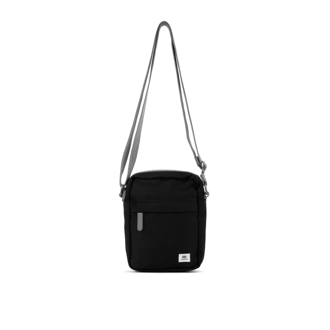 A compact and lightweight weather-resistant ash Ori Bond Pocket Crossbody Bag with functional zip pockets, available at Be Charmed.
