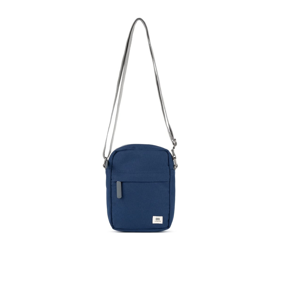 A compact and lightweight weather-resistant crisp blue Ori Bond Pocket Crossbody Bag with functional zip pockets, available at Be Charmed.