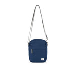 A compact and lightweight weather-resistant crisp blue Ori Bond Pocket Crossbody Bag with functional zip pockets, available at Be Charmed.