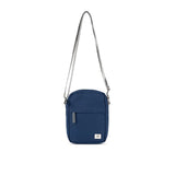 A compact and lightweight weather-resistant crisp blue Ori Bond Pocket Crossbody Bag with functional zip pockets, available at Be Charmed.