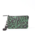 A green and dark brown animal print wristlet pouch with a black zipper and a black wrist strap, featuring a small black ORI London brand patch on the bottom right. Available at Be Charmed