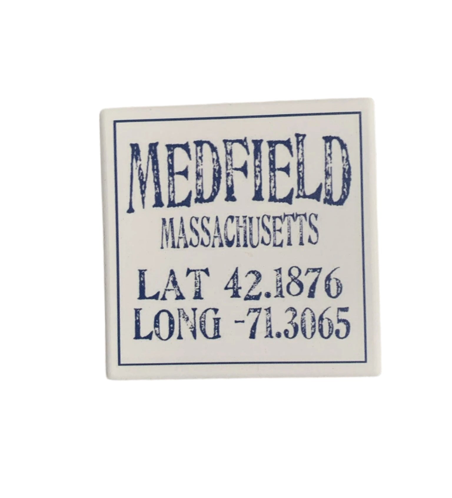 A square ceramic coaster with cork base featuring text that includes 'Medfield Massachusetts Lat 42.1876 Long -71.3051'. Available at Be Charmed
