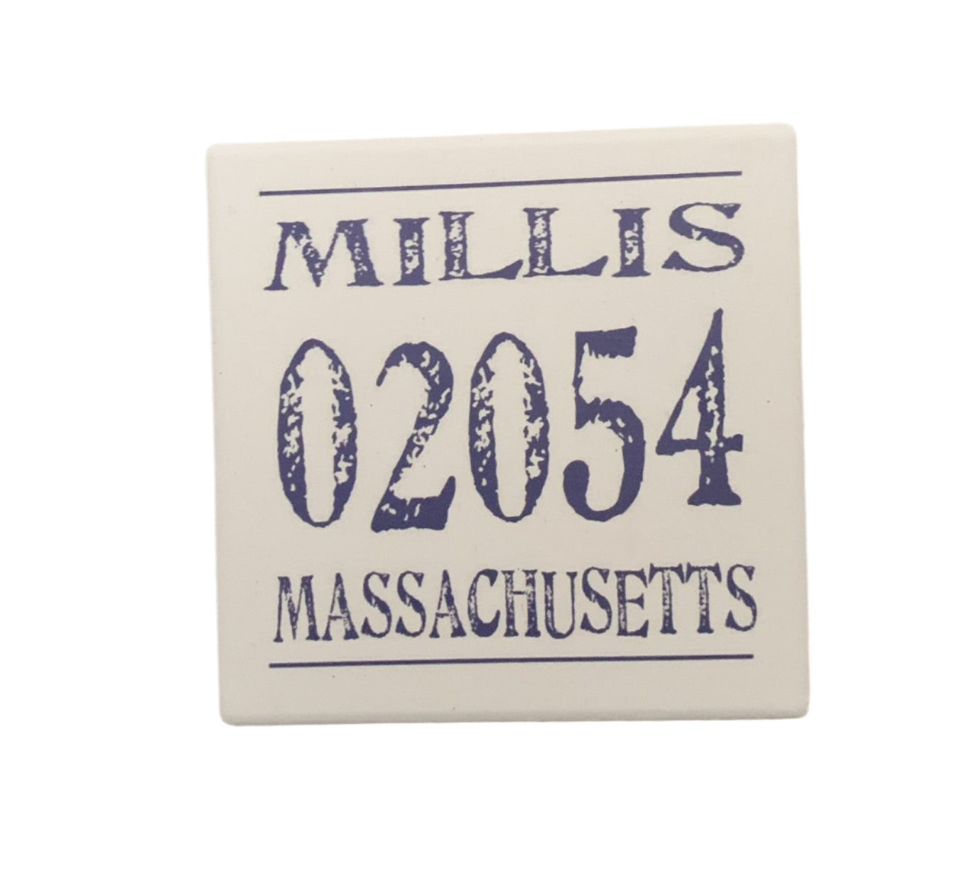 A square ceramic coaster with 'Millis 02054 Massachusetts' printed in blue. It has a cork base visible at the edges. Available at Be Charmed