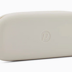 Cream Peepers silicone eyeglass case in soft, flexible material—ideal for protecting reading glasses or sunglasses. Lightweight and travel-friendly. Available at Be Charmed.
