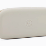 Cream Peepers silicone eyeglass case in soft, flexible material—ideal for protecting reading glasses or sunglasses. Lightweight and travel-friendly. Available at Be Charmed.