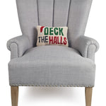 Gray armchair with a 'Deck the Halls' pillow on a white background. Available at Be Charmed