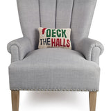 Gray armchair with a 'Deck the Halls' pillow on a white background. Available at Be Charmed