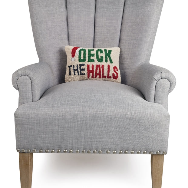 Gray armchair with a 'Deck the Halls' pillow on a white background. Available at Be Charmed