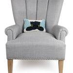 Gray armchair with a decorative pillow featuring a cat design on a white background. Available at Be Charmed