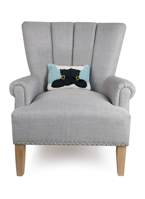 Gray armchair with a decorative pillow featuring a cat design on a white background. Available at Be Charmed