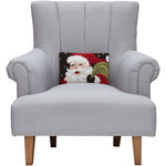 Gray armchair with a Santa Claus pillow on a white background. Available at Be Charmed