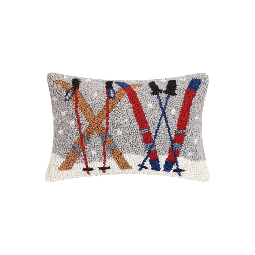Decorative pillow with skiing design on a white background. Available at Be Charmed