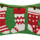 Decorative pillow with red and white stockings on a green background. Available at Be Charmed