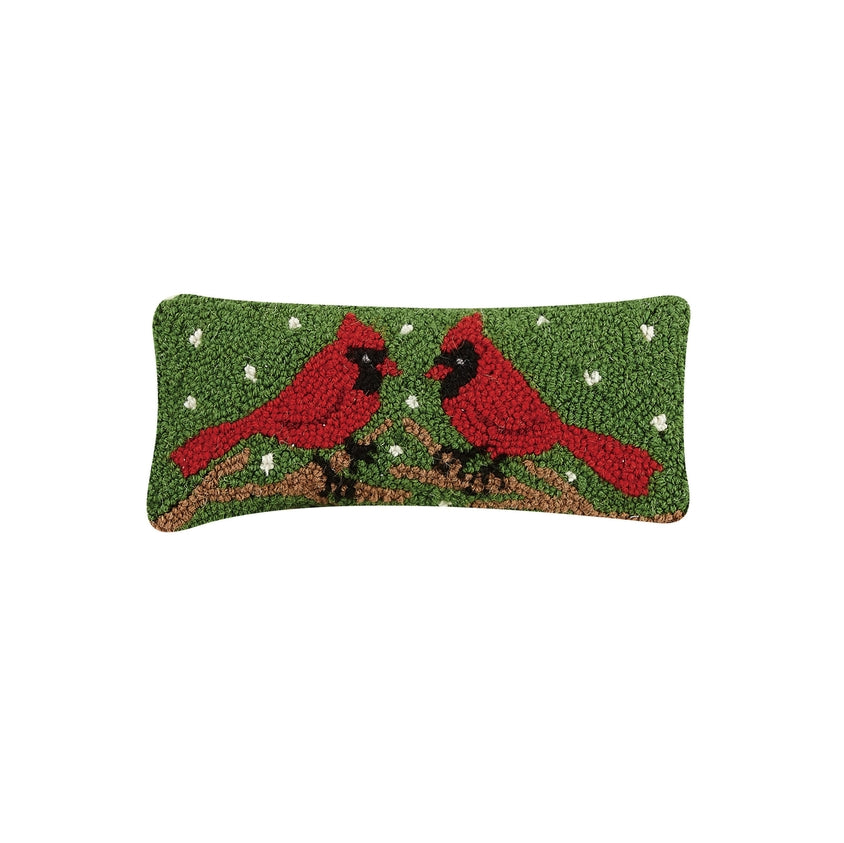 Decorative pillow with two red cardinals on a green background. Available at Be Charmed