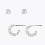 Set of silver hoop earrings on a white background. Available at Be Charmed