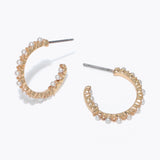 Gold hoop earrings with pearl accents on a white background Available at Be Charmed