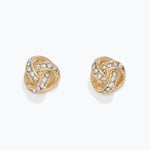 Gold earrings with intricate design and clear stones on a white background. Available at Be Charmed