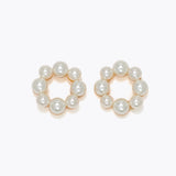 Pair of pearl hoop earrings on a white background. Available at Be Charmed