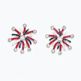 Pair of earrings with red, white, and blue starburst design on a white background. Available at Be Charmed