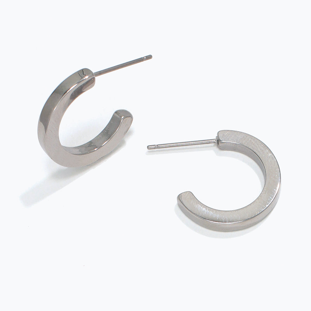 Silver hoop earrings on a white background. Available at Be Charmed