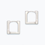 Pair of silver hoop earrings on a white background. Available at Be Charmed