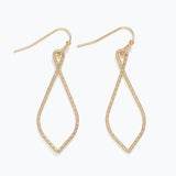 Gold teardrop earrings on a white background. Available at Be Charmed