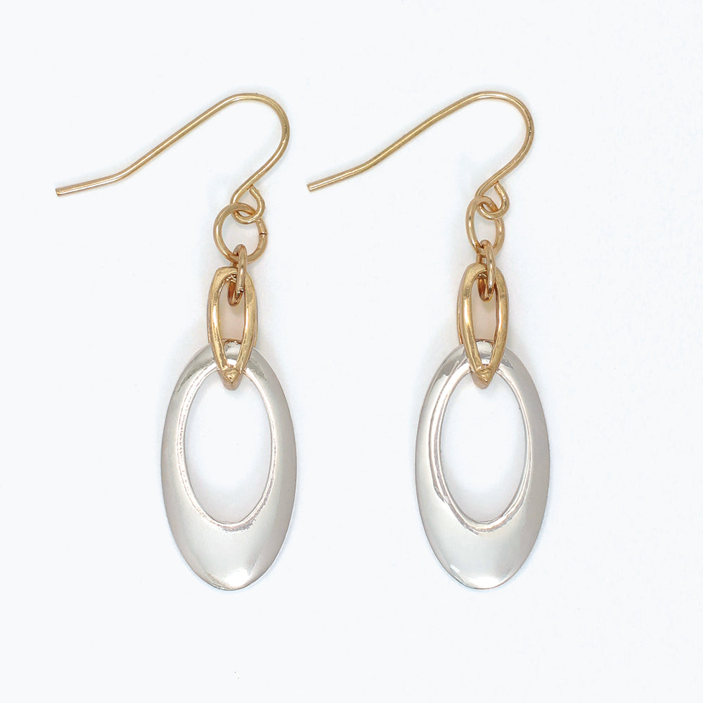 Gold and silver earrings on a white background. Available at Be Charmed