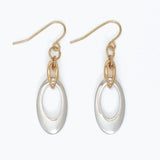 Gold and silver earrings on a white background. Available at Be Charmed