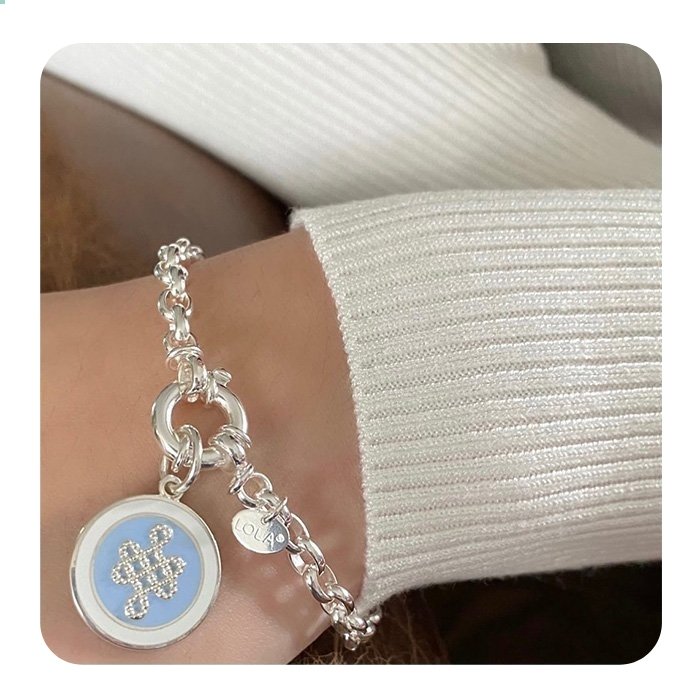 Person wearing a Lola Rolo Silver 5mm bracelet with classic chain design perfect for everyday wear and stacking, timeless jewelry piece, Available at Be Charmed