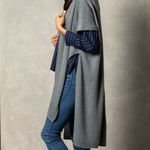 Pictured on woman Demdaco Recycled Knit Duster, soft eco-friendly knit wrap in neutral tones, perfect for layering—Available at Be Charmed.