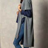 Pictured on woman Demdaco Recycled Knit Duster, soft eco-friendly knit wrap in neutral tones, perfect for layering—Available at Be Charmed.