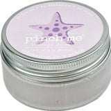 Jar of 'pinch me' therapy dough with a purple starfish design on the lid. Available at Be Charmed