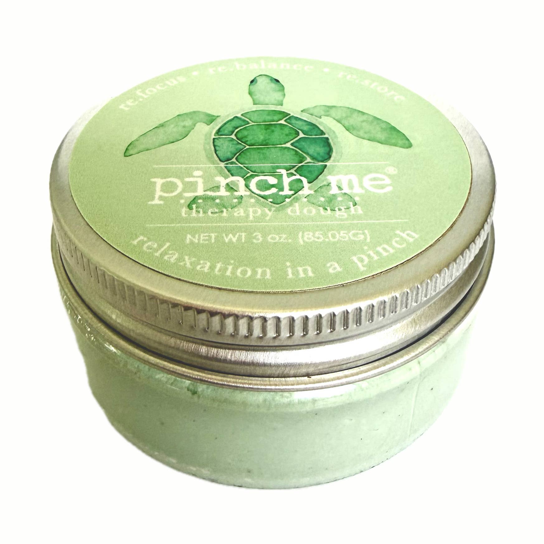 Green jar of 'pinch me' therapy dough with turtle design on lid. Available at Be Charmed