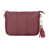 Deep Burgundy Pom Pom London City Slim Bag – handcrafted leather crossbody with sleek design and adjustable strap. Designed in London. Available at Be Charmed.