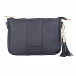 Navy Pom Pom London City Slim Bag – handcrafted leather crossbody with sleek design and adjustable strap. Designed in London. Available at Be Charmed.