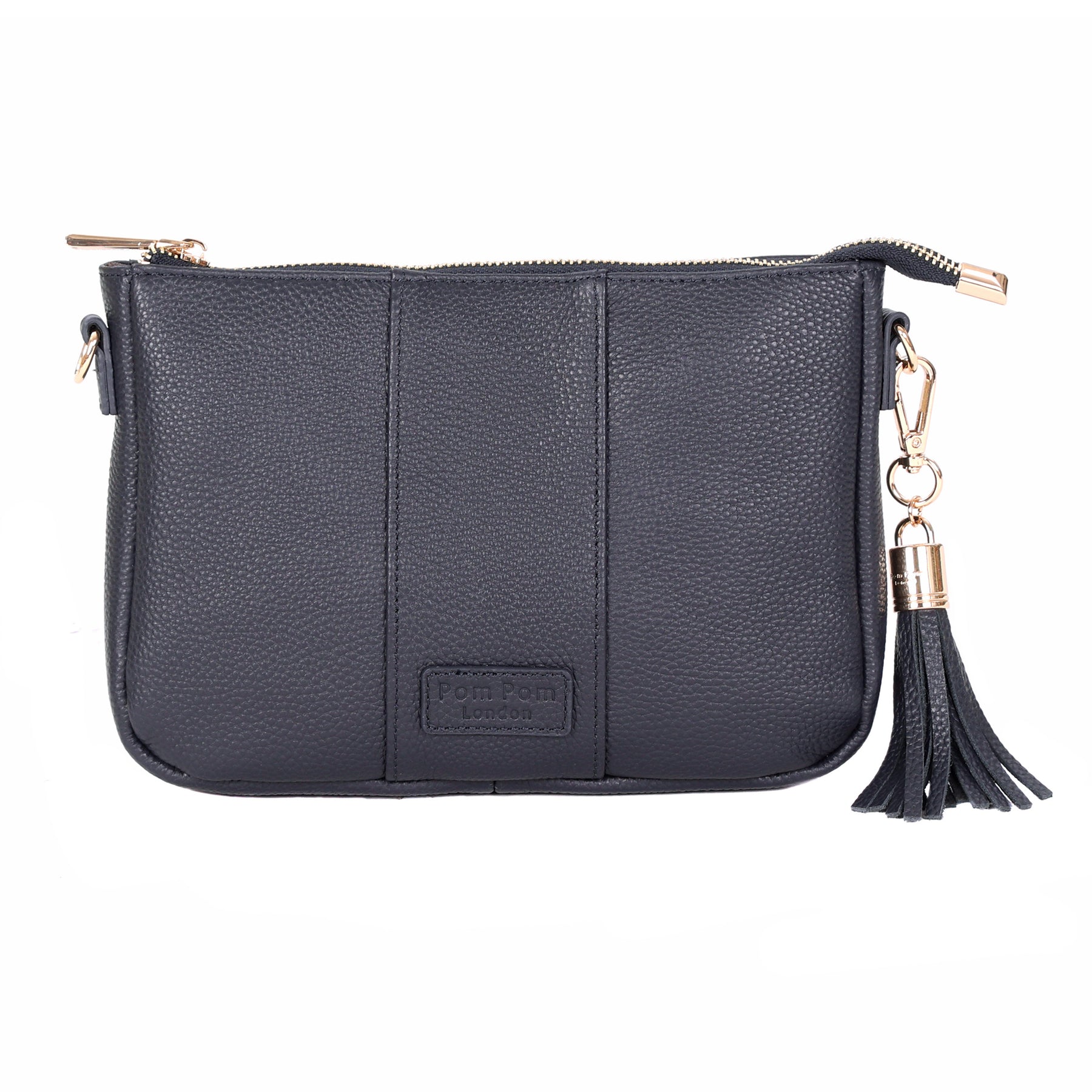 Navy Pom Pom London City Slim Bag – handcrafted leather crossbody with sleek design and adjustable strap. Designed in London. Available at Be Charmed.