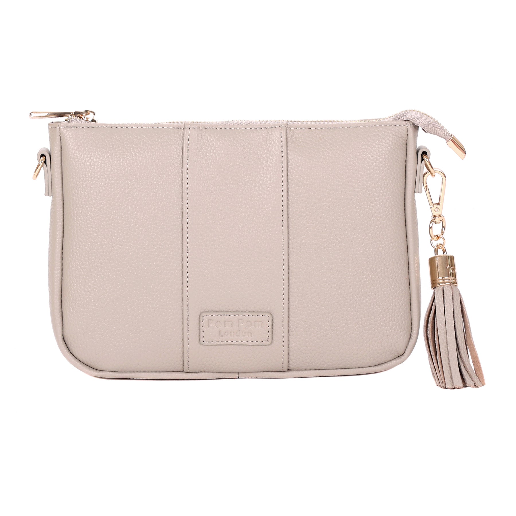Stone Pom Pom London City Slim Bag – handcrafted leather crossbody with sleek design and adjustable strap. Designed in London. Available at Be Charmed.