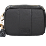 Black Pom Pom London City Bag – handcrafted leather crossbody with interchangeable straps and London-inspired design. Available at Be Charmed.