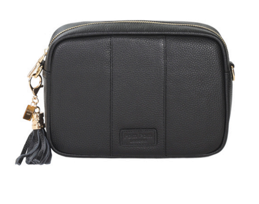 Black Pom Pom London City Bag – handcrafted leather crossbody with interchangeable straps and London-inspired design. Available at Be Charmed.