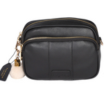 Black Pom Pom London Original Bag – classic handcrafted leather crossbody with adjustable and interchangeable straps. Available at Be Charmed.