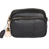 Black Pom Pom London Original Bag – classic handcrafted leather crossbody with adjustable and interchangeable straps. Available at Be Charmed.