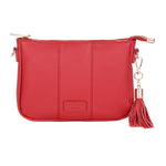 Crimson Red Pom Pom London City Slim Bag – handcrafted leather crossbody with sleek design and adjustable strap. Designed in London. Available at Be Charmed.