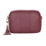 Deep Burgundy Pom Pom London City Bag – handcrafted leather crossbody with interchangable straps and London-inspired design. Available at Be Charmed.