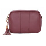 Deep Burgundy Pom Pom London City Bag – handcrafted leather crossbody with interchangable straps and London-inspired design. Available at Be Charmed.