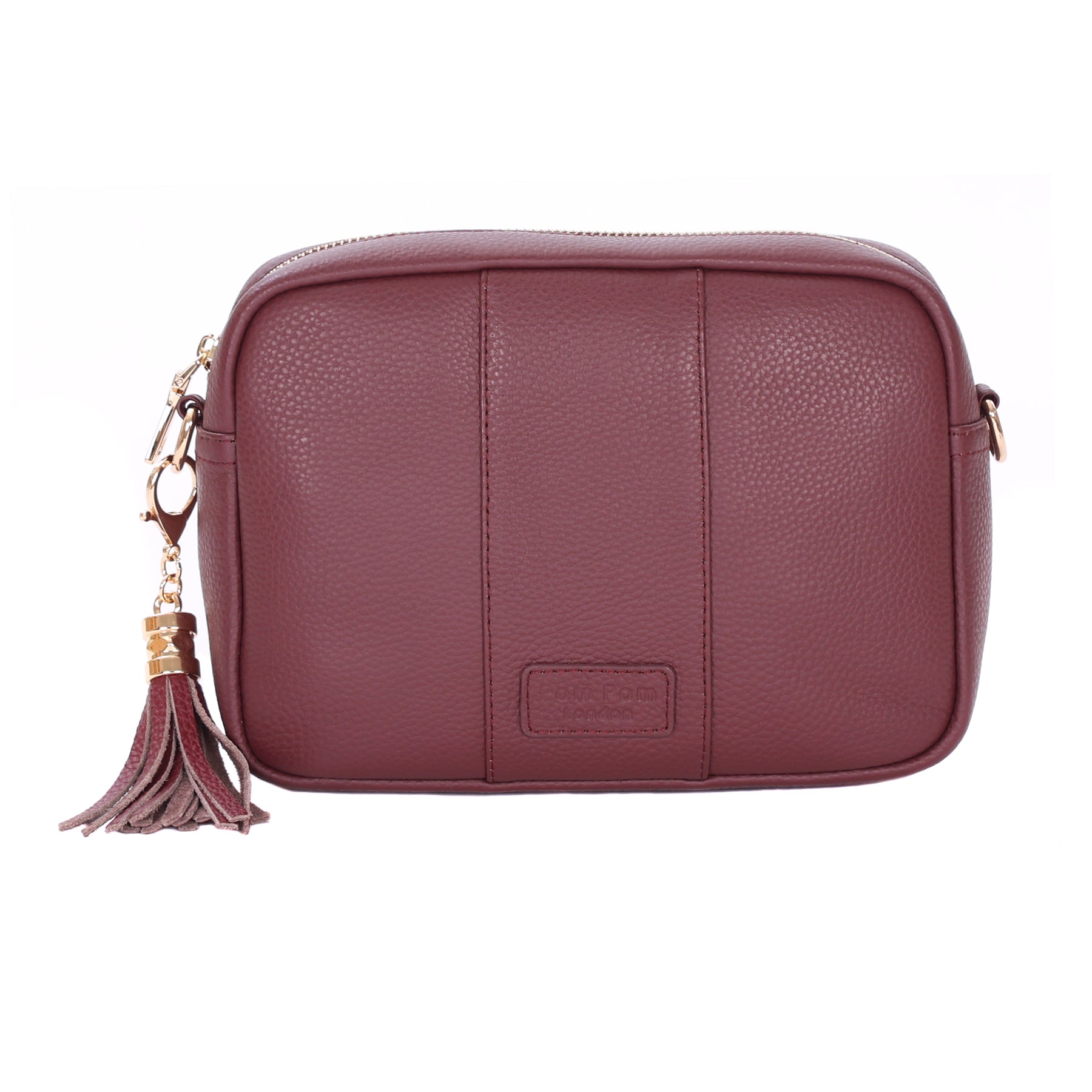 Deep Burgundy Pom Pom London City Bag – handcrafted leather crossbody with interchangable straps and London-inspired design. Available at Be Charmed.