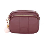 Deep Burgandy Pom Pom London Original Bag – classic handcrafted leather crossbody with adjustable and interchangeable straps. Available at Be Charmed.
